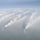 Illustration for article titled Massive offshore turbine arrays would help us harness hurricanes